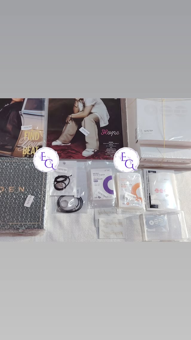 GOLDEN album with lightstick and photocard accessories flatlay